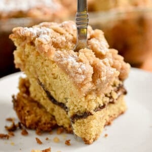 A fork is going through a piece of the sourdough coffee cake.