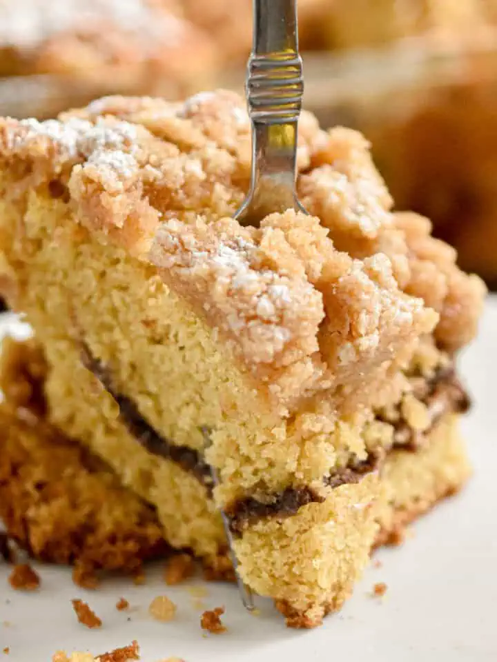 A fork is going through a piece of the sourdough coffee cake.