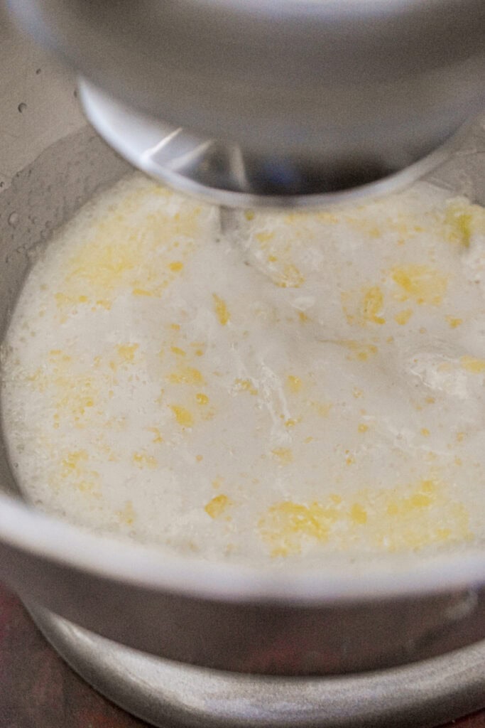 The wet ingredients are added to the bowl of the stand mixer.