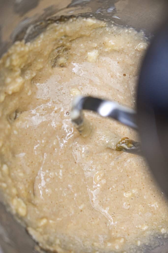 The wet ingredients are in the both of a stand mixer.