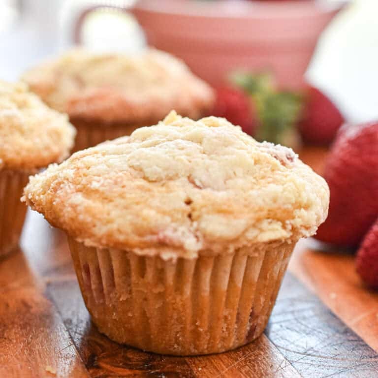 Delicious bakery-style strawberry muffins with a golden crumb and fresh strawberry flavor. Perfect f.
