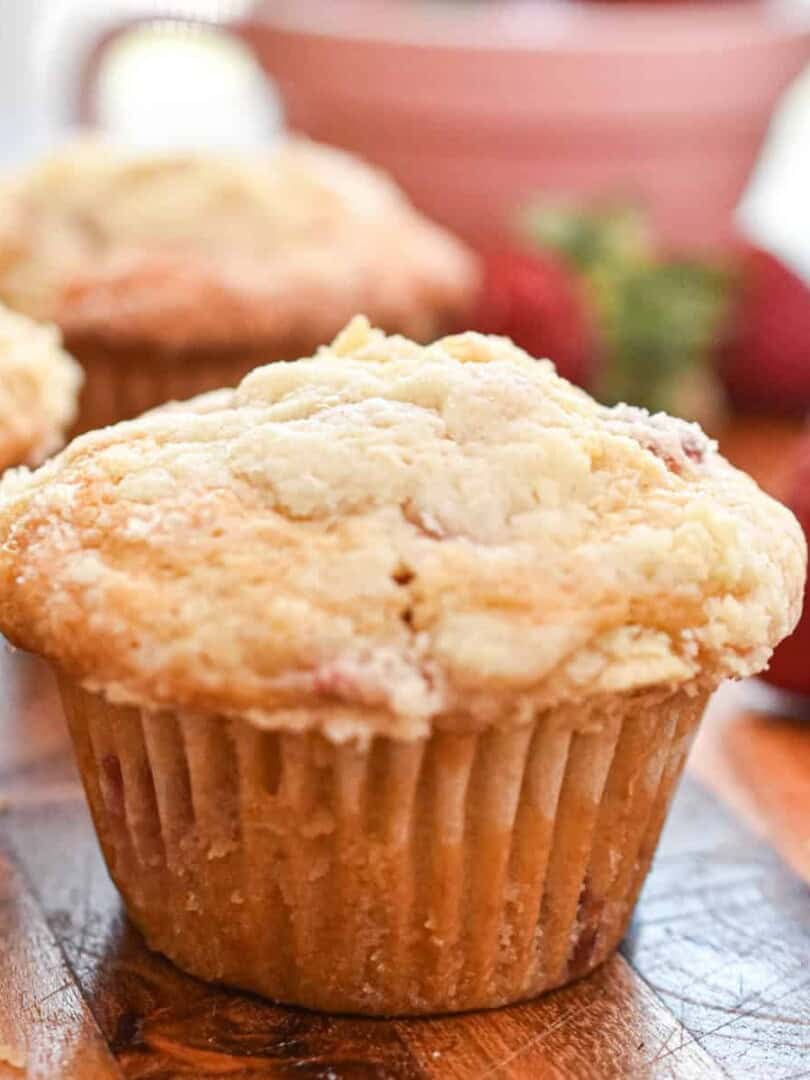 Delicious bakery-style strawberry muffins with a golden crumb and fresh strawberry flavor. Perfect f.