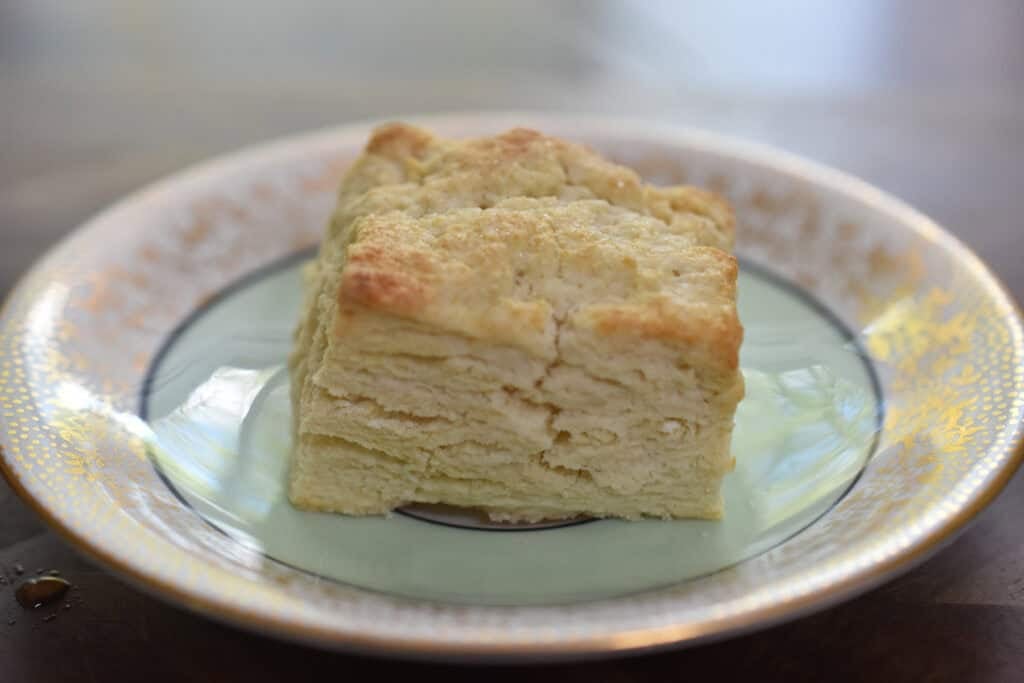 A baked biscuit is on a plate.