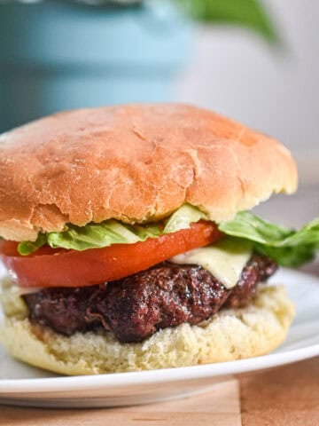 A hamburger is built on a sourdough discard hamburger bun.