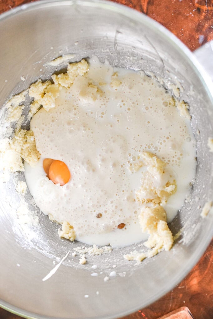 The wet ingredients are added to the bowl of the stand mixer.