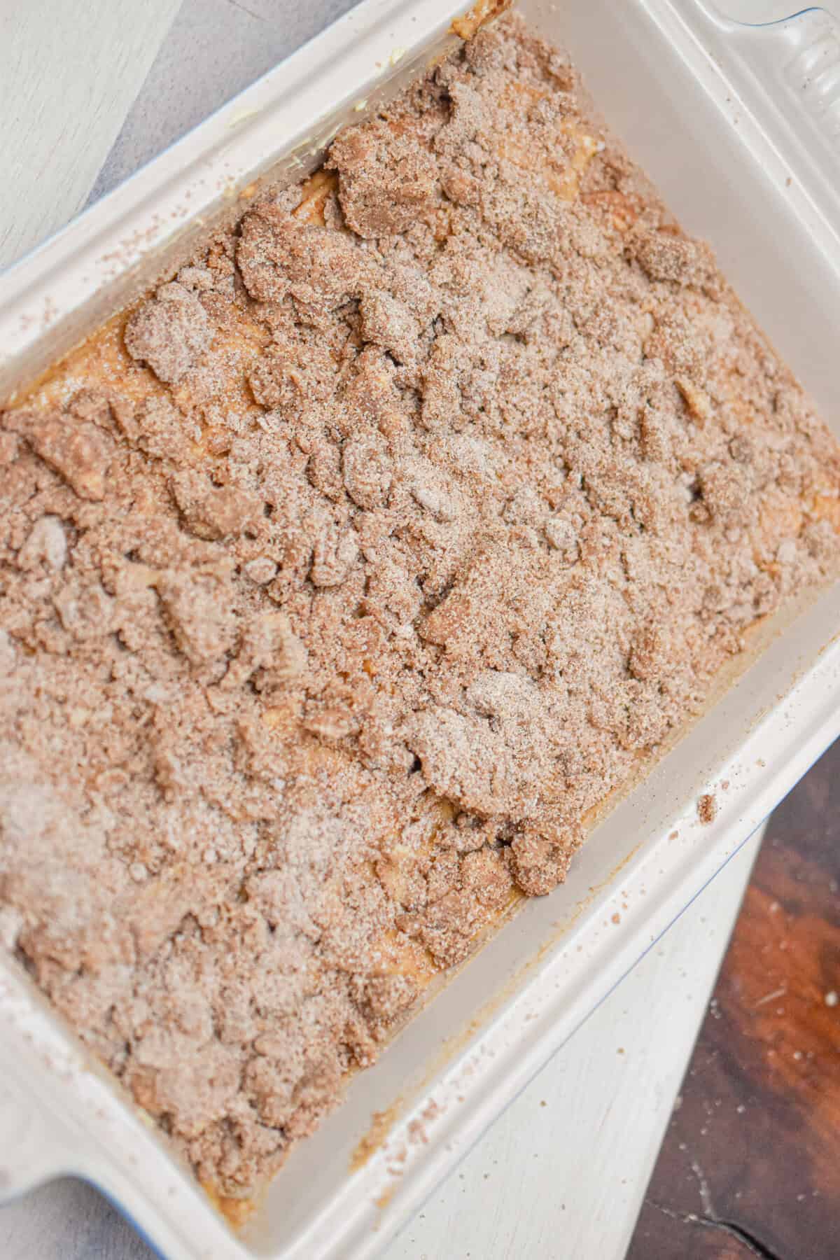 The crumble is added to the baking dish.