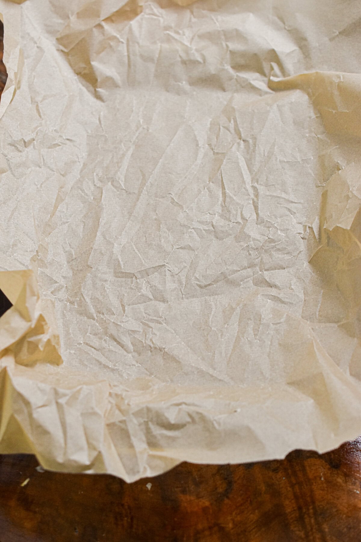 Parchment paper is lining a baking pan.