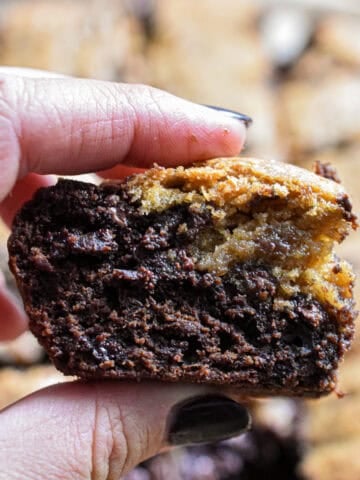 A hand is holding a sourdough brookie.