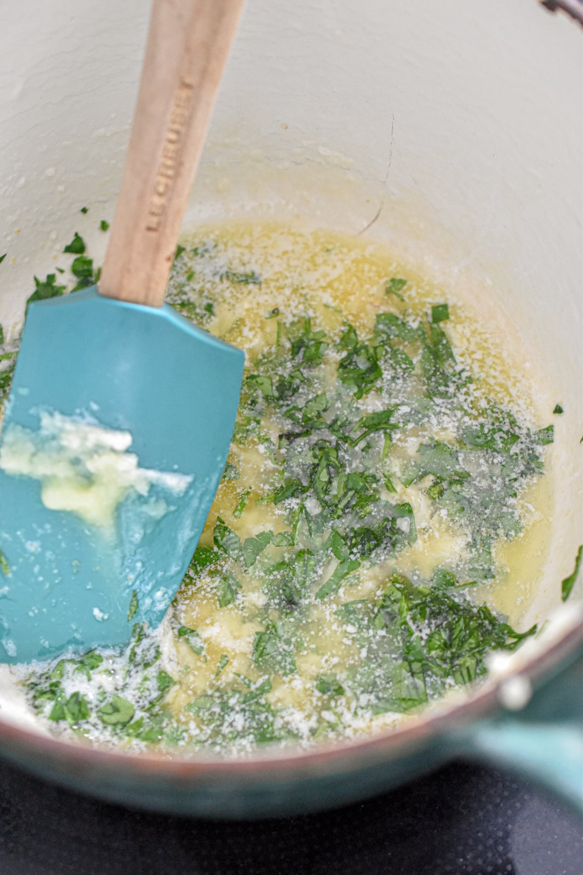 The garlic butter is in a small saucepan.